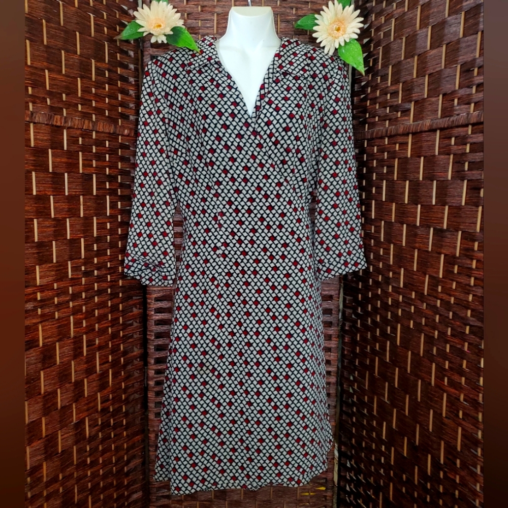 Talbots Dress with 3/4 sleeves. It opens completely and ties at the back with a